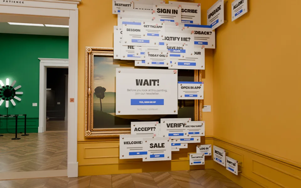 A gilt-framed landscape in a yellow room, covered by a pop-up window that says WAIT!